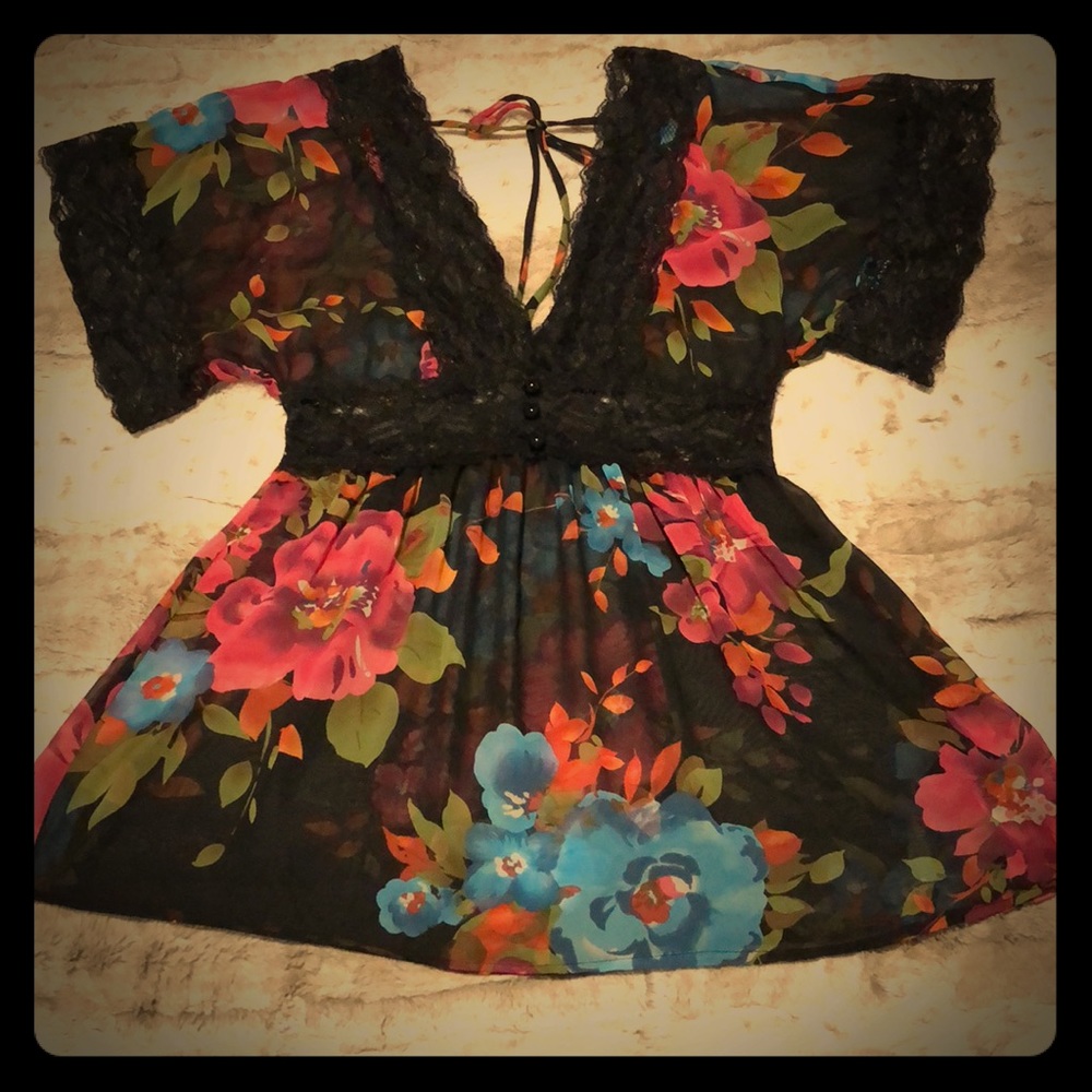 Floral blouse with lace details.